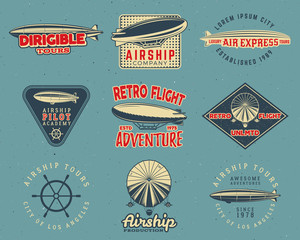 Vintage airship logo designs set. Retro Dirigible badges collection. Airplane Label vector design. Old airship design. Use as fly logos, labels, stamps, patches for web design, tee design, t-shirt. © jeksonjs