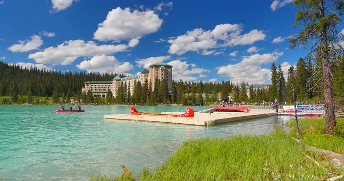 4K Beautiful Lake Louise and Canoe Paddlers on Summer Day - Powered by Adobe