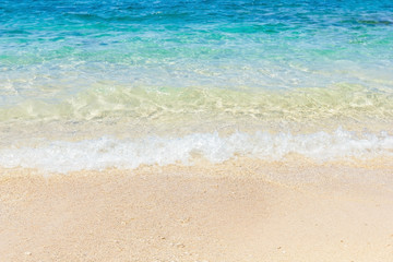 Fototapeta na wymiar wave of sea water on beach, summertime