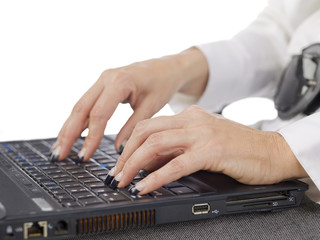 hands of a typing woman