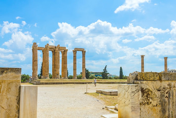 Ancient temple of Olympian Zeus on bright sunny and beautiful sky clouds, ruins of Athens, Greece