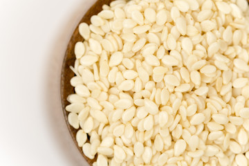 Flat lay wooden bowl with sesame