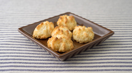 Side view of sugar free coconut macaroons in a dish