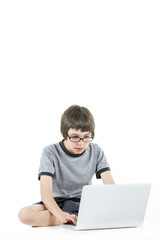 young boy in grey t-shirt with laptop