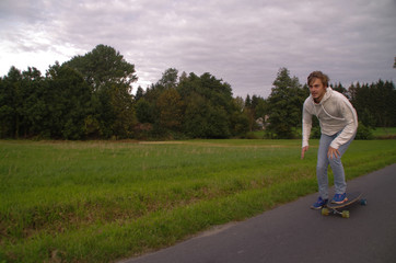 Man pushing longboard