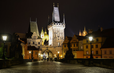 Fototapeta na wymiar A night view of Charles Bridge with Mala Strana and St. Vitus Cathedral in the background