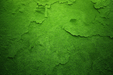 Green grass field with added cracked and damaged texture. Conceptual global warming copy space background.