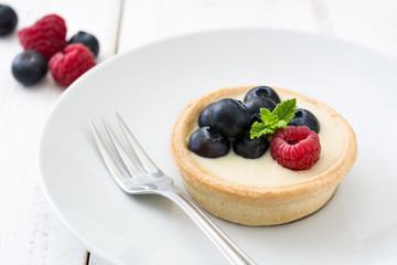 Delicious tartlets with raspberries and blueberries
