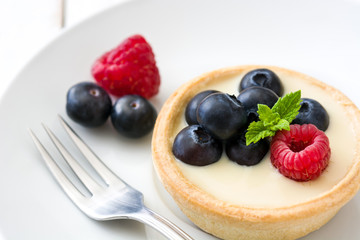 Delicious tartlets with raspberries and blueberries
