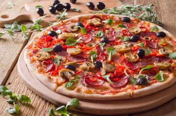Fresh pizza on wood