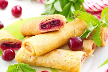 Pancakes with fresh cherries