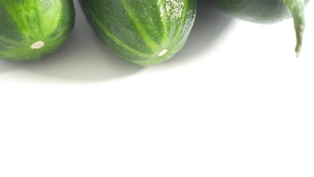 Cucumber 4K UHD 2160p footage panning on white background - Cucumber fresh vegetable in 4K UHD 3840X2160 high definition