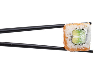 Salmon sushi roll in chopsticks isolated on white background