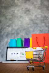 laptop and shopping bags, online shopping concept