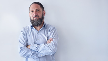 Portrait of older man with beard that is going grey