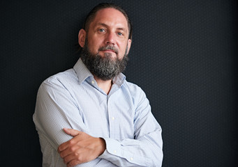 Portrait of handsome mature man with silvering beard