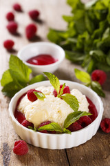 Light dessert with champagne and raspberry sauce