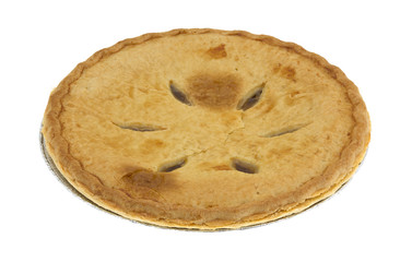 Side view of a sugar free apple pie isolated on a white background.