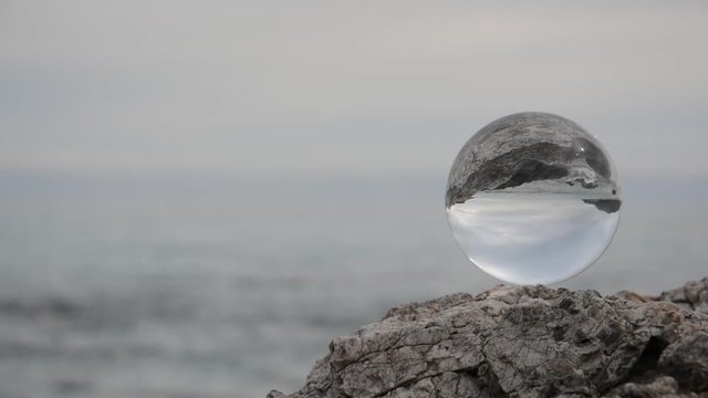 Crystal ball on sea