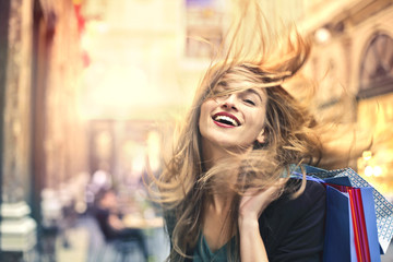 Happy woman doing shopping