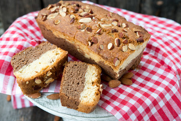Fototapeta na wymiar Vanilla cake with chocolate and nuts 