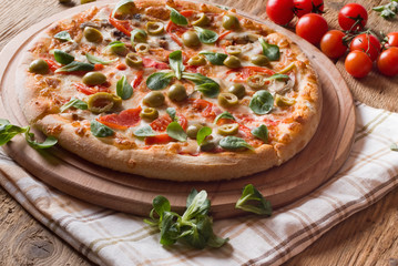 Fresh pizza on wood