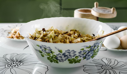 white bowl with roasted cabbage for pies