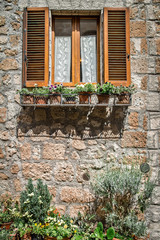 Fototapeta na wymiar Italian Windows with shutters