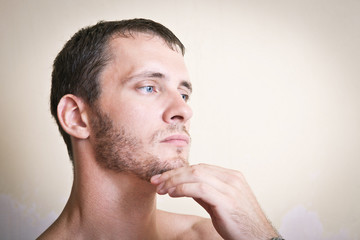 Obraz premium Portrait of thoughtful attractive man close up