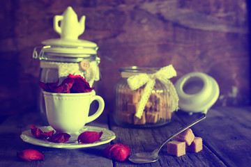 toned photo tea cup with sugar cubes