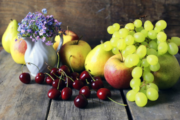 fresh raw fruit on wooden background