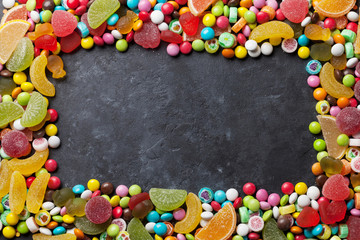 Colorful candies, jelly and marmalade over stone