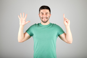 Man showing number by fingers