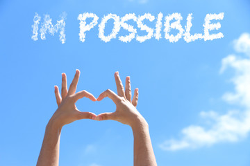 Word impossible transformed into possible on blue sky