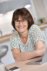 Senior woman using laptop computer