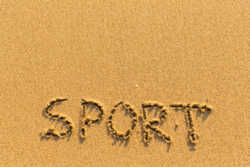 Sport - word drawn on the sand beach.