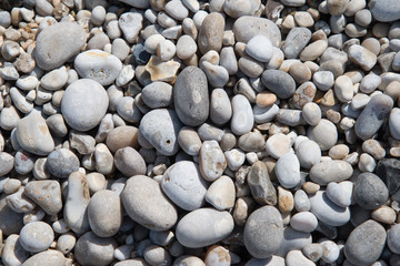 Fototapeta na wymiar Pebbles backgound from alabaster coast of Normandy