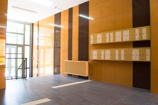 Entrance in modern building with mailboxes