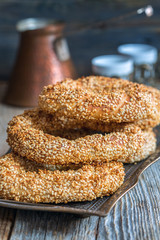 Bagels with sesame seeds on a tray closeup.