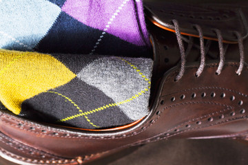 leather shoe and argyle sock