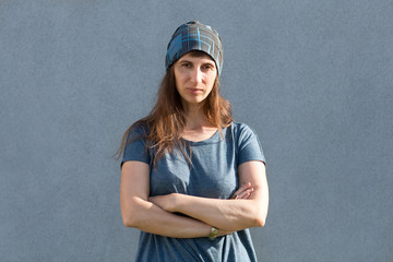 Portrait of a normal girl looking camera. / Beautiful woman portrait over grey background.
