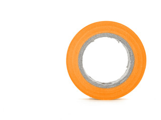 Protecting sticky orange insulating tape coil isolated on white background