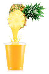 Pure pineapple juice pouring out from fruit in plastic cup
