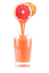 Pure grapefruit juice pouring out from fruit in glass - obrazy, fototapety, plakaty