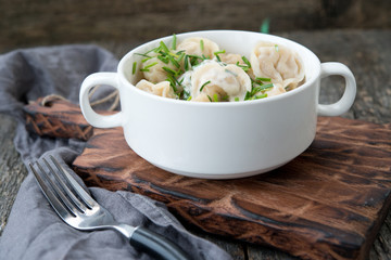 Boiled sour cream and greens pelmeni
