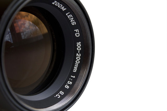 Detail of the old zoom lens on a camera, white background, large space for text