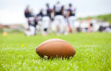 American football ball on the field