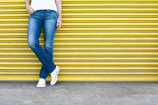 Closeup Of Female Wearing Jeans.


