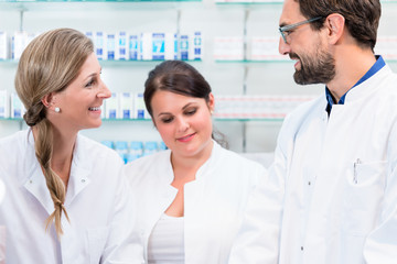 Team of apothecaries in pharmacy