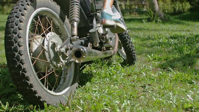 Kick Starting a Motorcycle and driving away. Slow motion